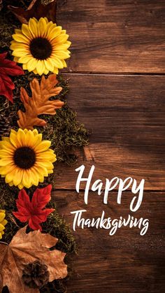 a happy thanksgiving card with sunflowers and leaves on a wooden background that says, happy thanksgiving