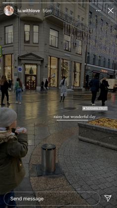 people walking on the street with buildings in the background