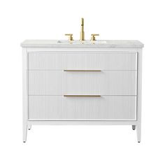 a white vanity with two gold handles and a marble top, in front of a white background