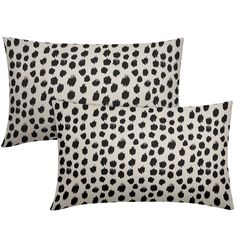 two pillows with black and white spots on them