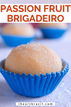 a close up of a muffin in a blue wrapper with the words passion fruit brigade