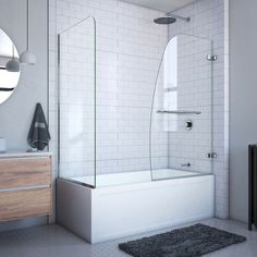 a white tiled bathroom with a walk in shower