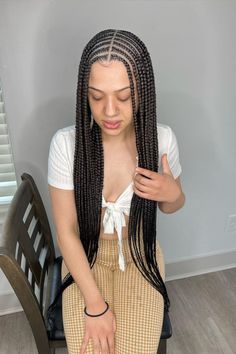 25 Stylish Middle Part Tribal Braids: Centering Tradition with Trend Long Braids For Black Women Hairstyles, Side Style Hairstyles, Middle Part Tribals, Middle Part Braids Black Women, Trible Braids Hairstyles, Middle Part Feed In Braids, Middle Part Cornrows Braids, Middle Part Fulani Braids, Middle Part Cornrows