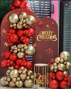 a christmas tree made out of red and gold ornaments