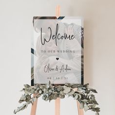 a welcome sign on top of an easel