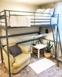 a bunk bed sitting next to a chair in a room with carpeted flooring