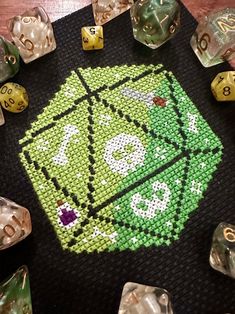 a close up of some dice on a table with many other dices around it