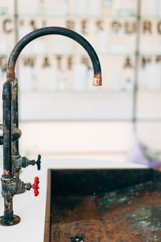 an old fashioned faucet is attached to a sink