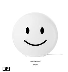 a white plate with a smiley face on it's side and the words happy face front