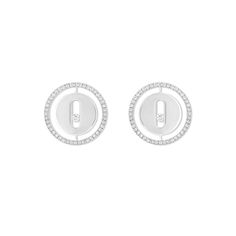 a pair of earrings with diamonds in the shape of a circle on top of each other