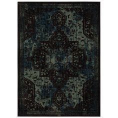 a blue and black rug with an intricate design on the bottom, it is very dark