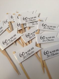 there are many wooden matches with labels on them that say 60 is not old, it's classic