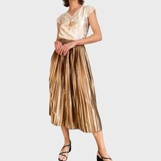 Make a statement with this stunning vintage gold pleated skirt. Featuring a high rise and A-line silhouette, this long skirt exudes unique feminine charm. Perfect for special occasions or adding a touch of glamour to your everyday look. Available in size M. CONDITION: Great Vintage Condition FABRIC: 100% Polyester SIZE: UK10/M; EU38/M; will suit other sizes depending on desired fitting Model size S/M; 5'11 FLAT LAY MEASURES: /Waist 13.5in (elastic waist) /Hips ~23in /Length 33in POSTING from Lit Gold Pleated Skirt, High Rise Skirt, Pleated Long Skirt, Lithuania, Long Skirt, Everyday Look, Vintage Gold, Pleated Skirt, Favorite Outfit