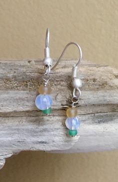 Sweet little dangly earrings created with one frosted green & one frosted yellow glass bead and one opalescent white translucent glass bead, hanging from a matte silver wire. Earrings will be packaged in a little linen bag and wrapped in colorful tissue paper. Please let me know if this is a gift, and I will wrap it up in a small bag tied with ribbons! Thank you for stopping by to check out my new items at The Joy Collective Company! Love well, Kelly Silver Wire Earrings, Love Well, Earrings Beach, Glass Bead Earrings, Glass Drop Earrings, Translucent Glass, Gemstone Beads Jewelry, Earrings Minimalist, Dangly Earrings