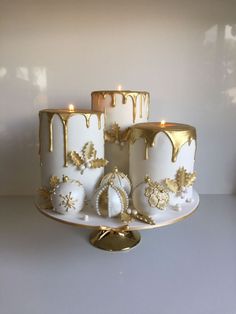 a white cake with gold decorations on it