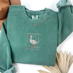 Comfort Colors Embroidered Shirt Sweatshirt Silly Goose On the Loose T-Shirt Goose Crewneck Shirt Silly Goose Shirt Funny Gift, MADE IN USA. BRAND: Comfort Colors 1566 PRODUCT INFORMATION: 9.5 oz./yd² (US), 15.9 oz/L yd (CA), 80/20 ring-spun cotton/polyester, 30 singles Garment-dyed for a lived-in feel and minimal shrinkage at home 3-end cotton face fleece made with 100% cotton threads Relaxed fit 1x1 ribbed collar, cuffs, and waistband Rolled-forward shoulder Back neck patch for easy customizat Bape Goose Shoes, Silly Goose Embroidery, Silly Goose Sweatshirt, Comfort Colors Sweatshirt, Silly Goose, Cute Shirt Designs, Crew Neck Shirt, Embroidered Shirt, Cute Shirts