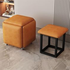 two orange stools sitting next to each other