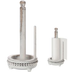 a silver metal holder with two candles on it