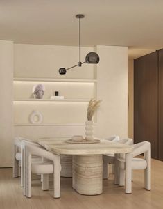 a modern dining room with white chairs and a marble table