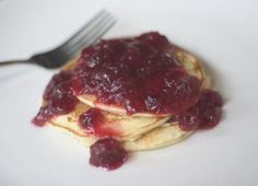 pancakes with jam on top and a fork