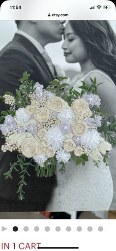 a wedding photo with the bride and groom holding a bouquet of flowers in front of them