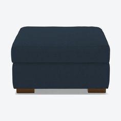 a blue footstool sitting on top of a white floor