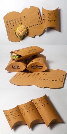 several pieces of brown paper are stacked on top of each other with sandwiches in them