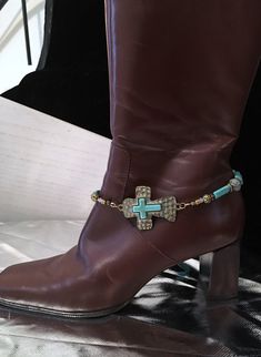 "ANTIQUE BRONZE SIDEWAYS CROSS BOOT BRACELET !! Add a little BLING to your wardrobe with boot jewelry  ~ This great looking HAMMERED CROSS CONNECTOR has a patina finish, with a smaller inlaid turquoise magnesite cross.  The design is made up of puffed magnesite beads and a variety of patina finished metal spacers and a couple of clear faceted Austrian crystals.   The total length of the bracelet is 15\" and is strung on professional strength beading wire.  This is a real beauty !!  Definitely on Cowgirl Jewelry Rodeo, Boot Bracelet, Cowgirl Bling, Boot Bling, Western Style Boots, Cowgirl Jewelry, Handmade Boot, Turquoise Cross, Jewelry Words