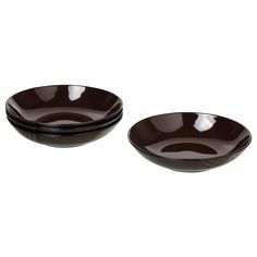 two black bowls sitting next to each other