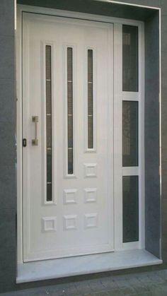 a white front door with glass panels