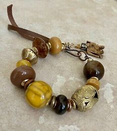 Tribal Boho Bracelet Vintage Resin and African Ethnic Lost Wax Brass Beads | eBay Bohemian Wooden Beads Bangle, Bohemian Bangle With Wooden Beads, Brown Hand Wrapped Beaded Bracelets For Festivals, Hand Wrapped Brown Beaded Bracelets For Festivals, Bohemian Handmade Brown Beaded Bracelets, Bohemian Brown Beaded Bracelets As Gift, Bohemian Brown Beaded Bracelets For Gifts, Brown Spacer Beads For Festival, Brown Spacer Beads For Festivals