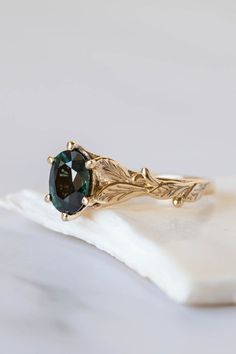 Oval Cut Teal Sapphire Ring, Sapphire Engagement Ring Oval, Oval Sapphire Engagement Ring, Gold Leaf Rings, Nature Inspired Engagement Ring, Green Gemstone Ring, Leaf Engagement Ring, Organic Lines