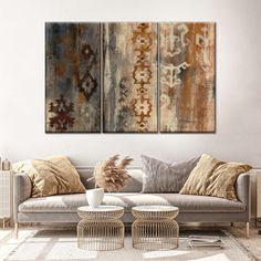 a living room with two paintings on the wall