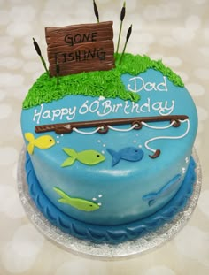 a birthday cake for someone's 80th birthday is decorated with fish and a sign that says, gone fishing