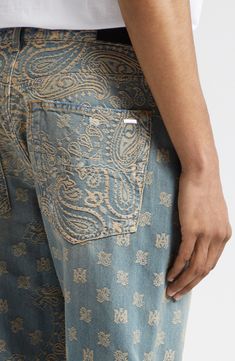 The label's signature paisley pattern is jacquard-woven into the nonstretch denim of these straight-leg jeans lent a broken-in look via distressed patches. 33 1/2" inseam; 16" leg opening; 11 1/2" front rise; 15" back rise (size 29) Zip fly with button closure Five-pocket style 100% cotton Dry clean Made in the USA Designer Clothing Paisley Streetwear, Etro Paisley Jeans, Patches On Denim, Custom Jeans Men Street Styles, Trussardi Jeans, Jeans Bordado, Pants Pocket, Edgy Mens Outfits, Design Jeans