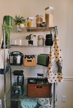 the shelves are filled with kitchen items and cooking utensils