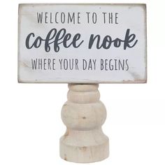 a sign that says welcome to the coffee nook where your day begins