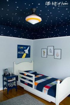 a child's bedroom with stars painted on the ceiling