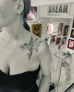 a woman with a bird tattoo on her chest