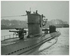 an old photo of a submarine in the water