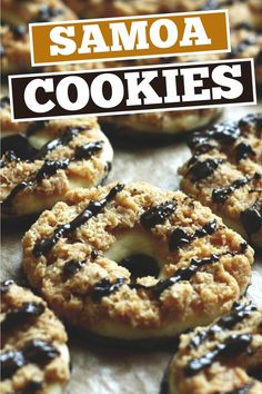 a close up of doughnuts on a baking sheet with the words samoa cookies above them