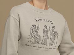 Greek Mythology Sweatshirt The Fates Shirt Poet Shirt Bookish Sweatshirt Literary Sweater Moirai Greek Goddess Ancient Greece Light Academia * DESIGN: Hand printed using DTG (Direct To Garment) method with certified pigment inks (Innobella Textile Inks) - high durability and washability as the ink has scored 4.0 or higher on the AATCC wash test Features air jet yarn for a softer feel and reduced piling and the collar is ribbed knit, so it retains its shape even after washing Knit in one piece us Poet Shirt, Light Academia, Greek Goddess, Ancient Greece, Greek Mythology, Things To Buy, Crew Neck Sweatshirt, Tshirt Designs, Sweatshirts Hoodie