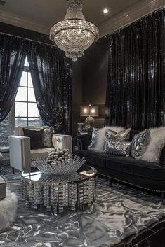 a living room filled with furniture and a chandelier