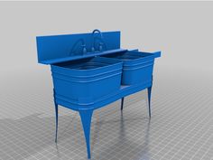 a blue sink with two buckets on the top and one basin in the middle