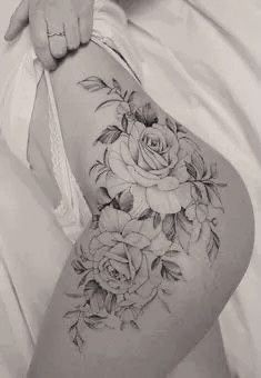 a woman's thigh with roses on it