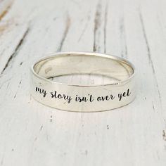 My Story Isn't Over Yet Inspiration ring, Ring for woman, Adjust ring. Material: Stainless steel Stamp: S925 Nickel and Lead free Hypoallergenic / Made for Sensitive Skin We are so thankful for every single order you place with us! If this is a gift we can ship directly to the recipient and include a personalized note. Not to worry, we never include invoices in the package and a gift receipt can be requested. Want this item gift wrapped? We offer gift wrapping at checkout. Engraving Ring, Godly Things, Ring Engraving, Hair Items, Engraved Bangle, Cheap Silver Rings, Sunflower Jewelry, Steel Stamp, Handmade Gold Jewellery