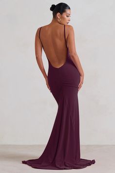 Who says the bride can solely bring the drama? Our latest maxi dress known as Adele is crafted from premium ruched jersey in deep plum. A plunging back is supported from delicate straps which can be adjusted for the perfect fit whilst a fishtail skirt showcases a godet train from behind.  Features - Premium stretch jersey - Horizontal ruching - Cowl draped neckline - Adjustable cami straps - Open back - Fishtail skirt - Godet train - Maxi length  Sizing & Fit Model is 5'8.5 and wears UK size 8 / US size 4  Product Information   Double layered with excellent stretch Premium jersey in Plum (95% Polyester, 5% Elastane) 157cm total length SKU: CL128390069