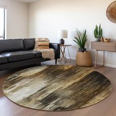 a living room with a couch, chair and rug