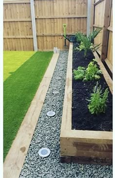 an outdoor garden area with grass and gravel