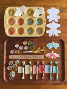 an assortment of crafting supplies laid out on a tray